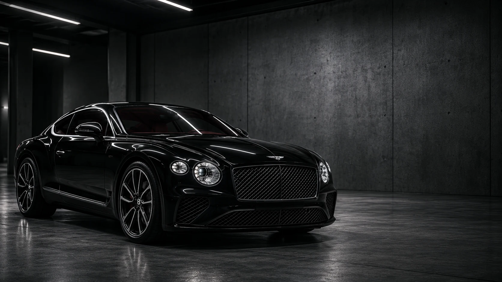 Black coupe in a softly lit workshop